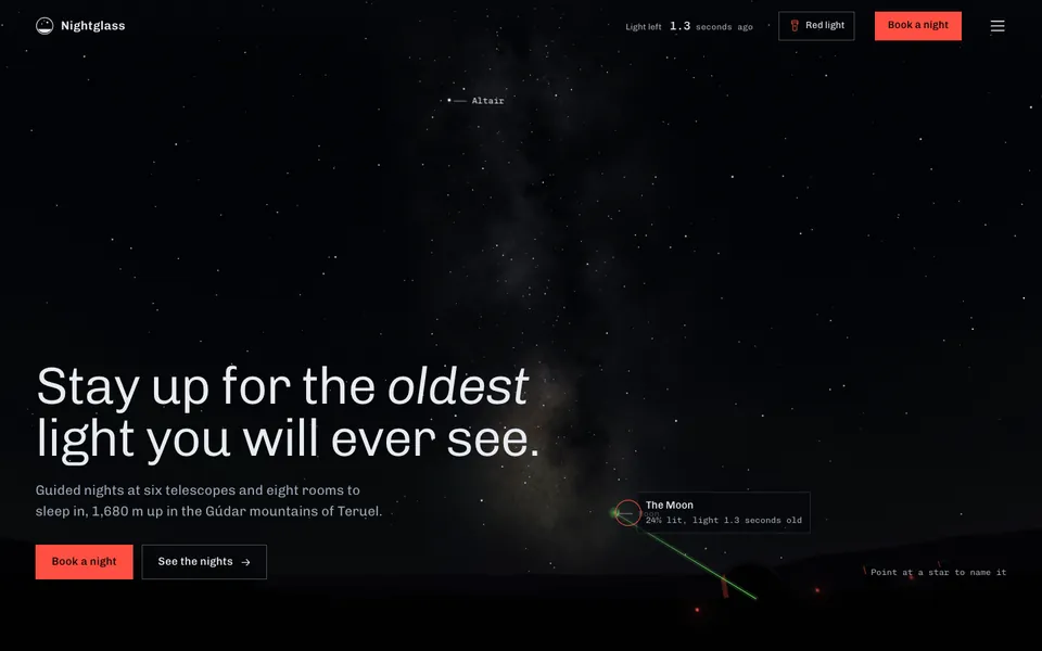 Nightglass hero: the night sky over a mountain ridge with observatory domes.